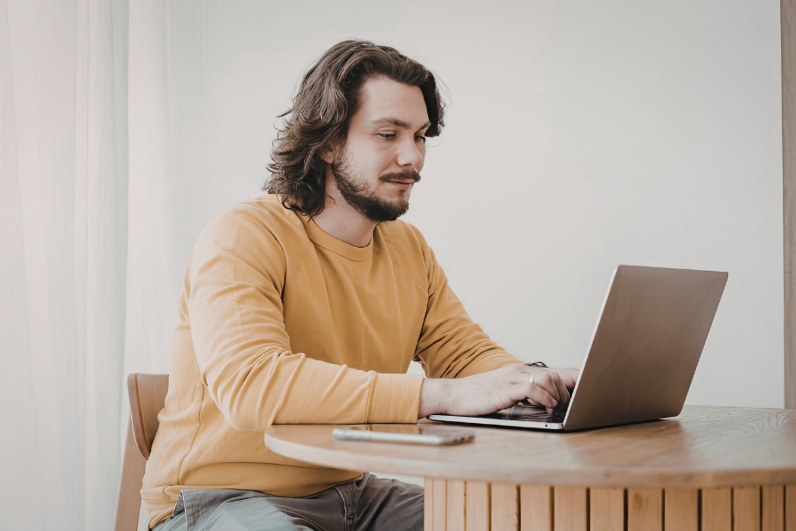 Person watching a Zoom program with captioning.