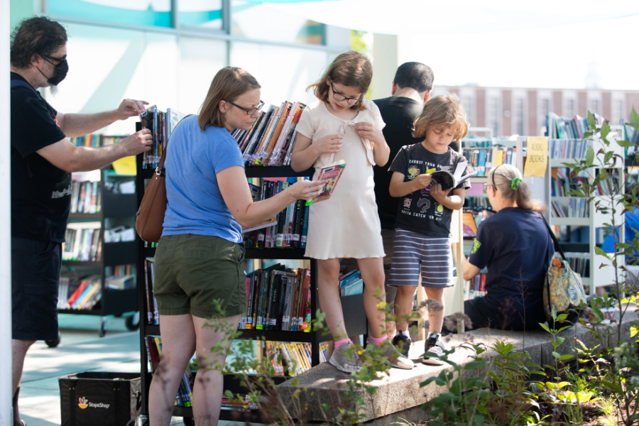 People of all ages at a book sale.