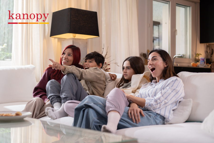 Group of people watching a movie, points to Kanopy site.