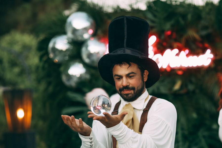 Performer putting on a show, points to program proposal submission.