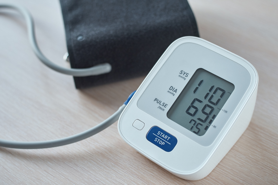 A blood pressure monitor, points to place a hold on wellness at the Main Library.