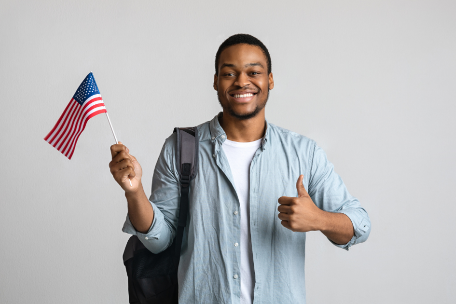 Person holding an American flag.