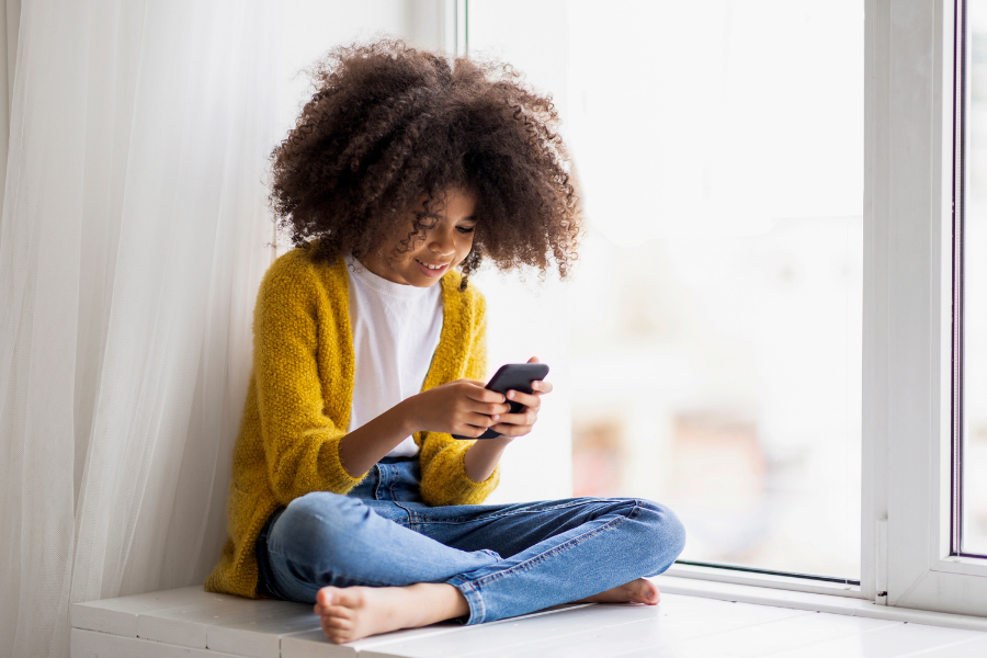 Girl reads on a phone.