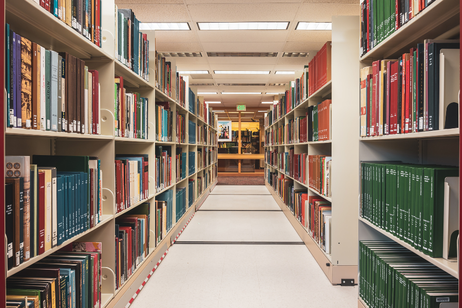 Stacks with shelves of government documents in a library.